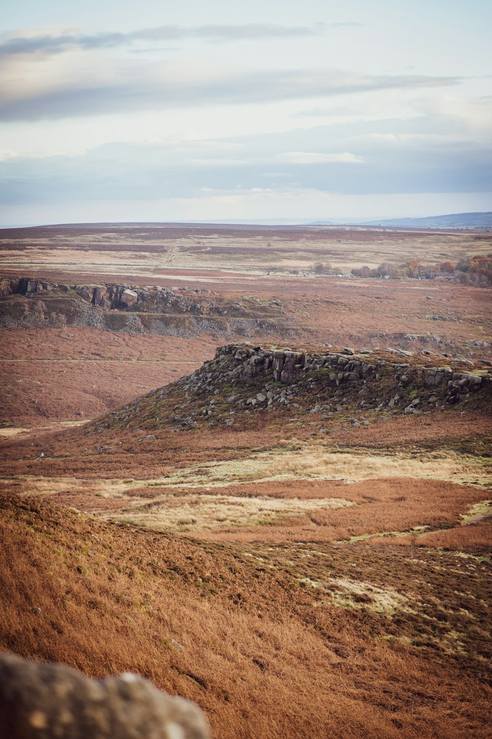 a rocky outcropping in the middle of a plain