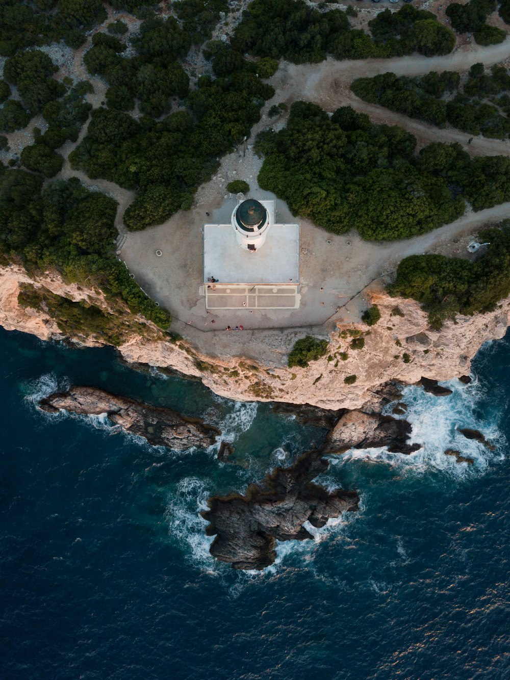 an aerial view of a small house on a small island