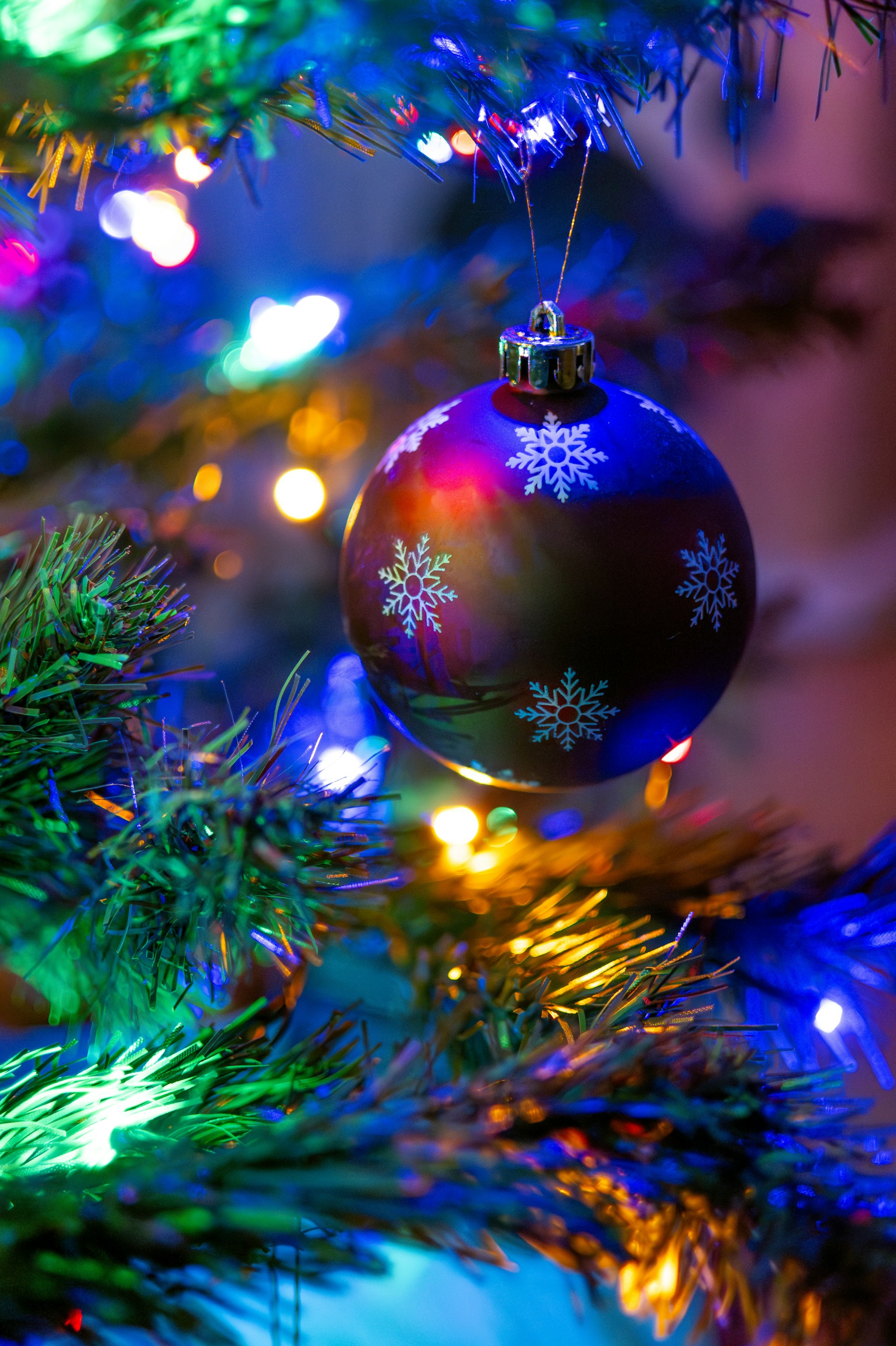 a close up of a christmas ornament on a tree
