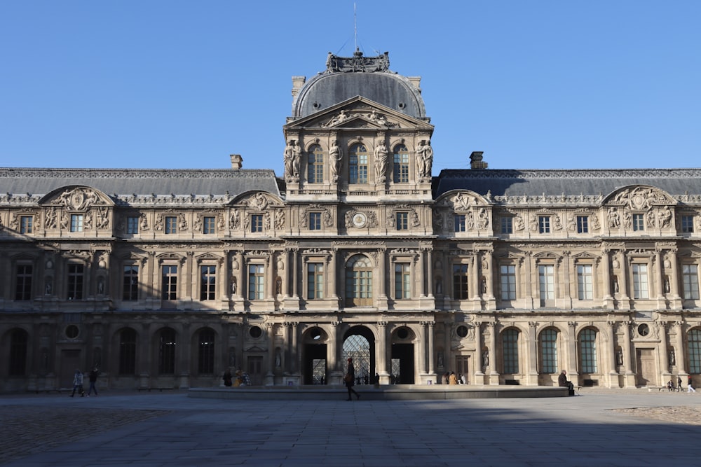 a large stone building with a clock tower