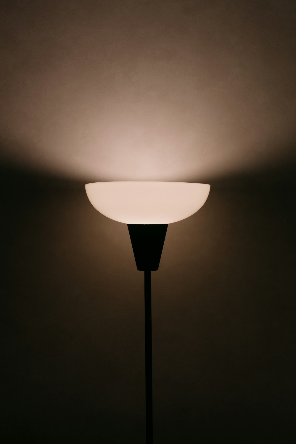 a lamp that is lit up in the dark
