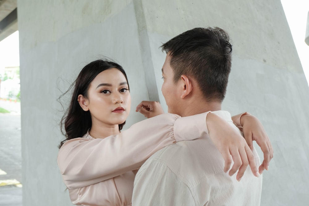 a man and a woman standing next to each other