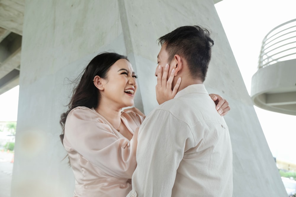 a man and a woman standing next to each other