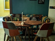 An inviting seating area with a mix of sofas and armchairs in warm colors.