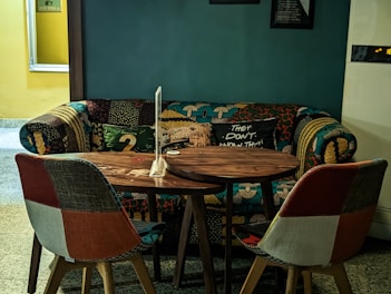 Inviting seating area with colorful textiles in the Cozy Deluxe room.