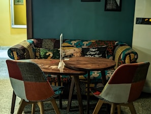 A cozy seating area with popular-style sofas and traditional rugs arranged for guests.