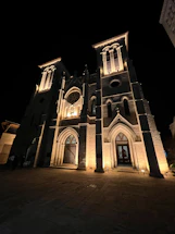A welcoming church entrance with warm lighting in the evening.