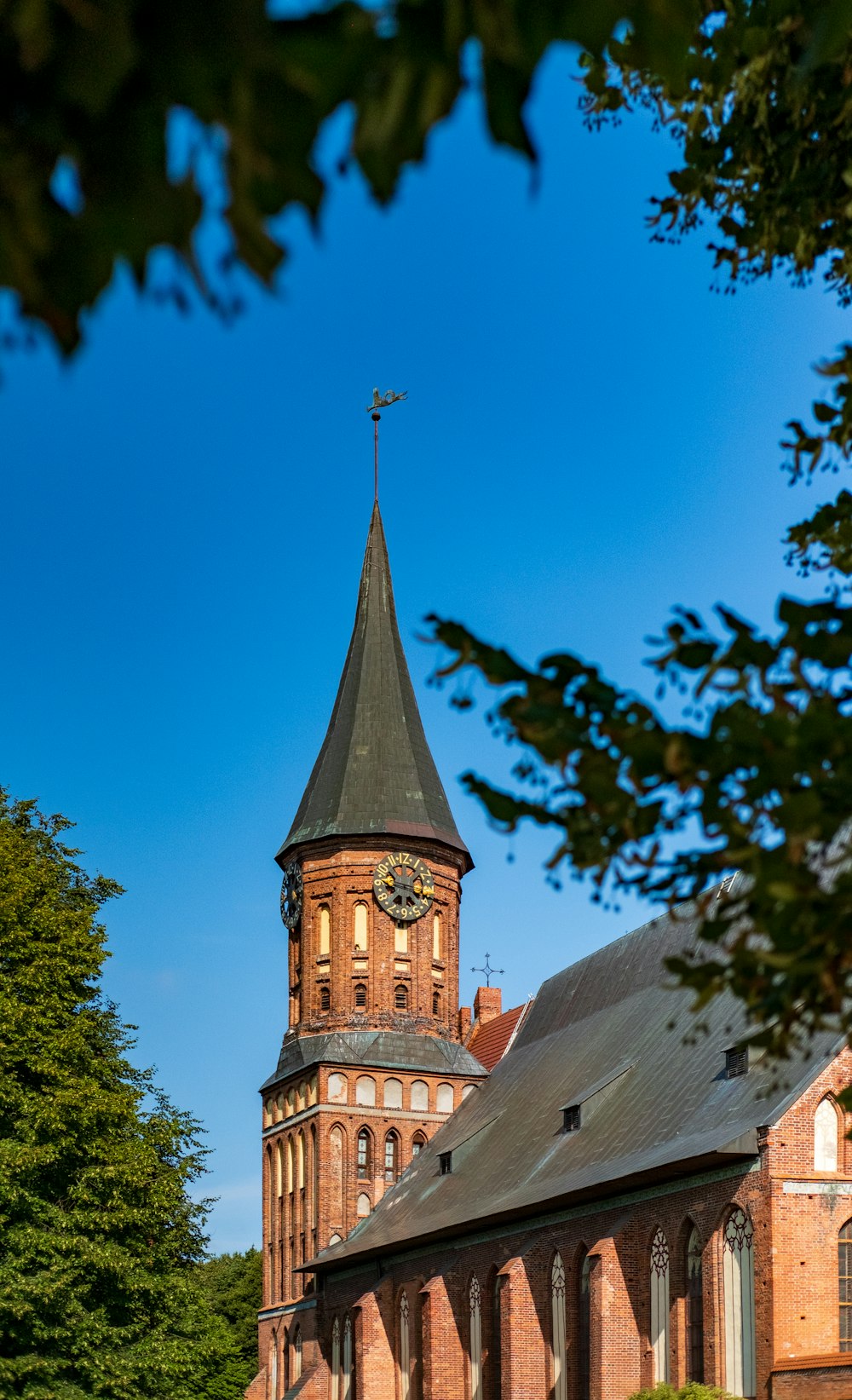 an old church with a clock tower in the background