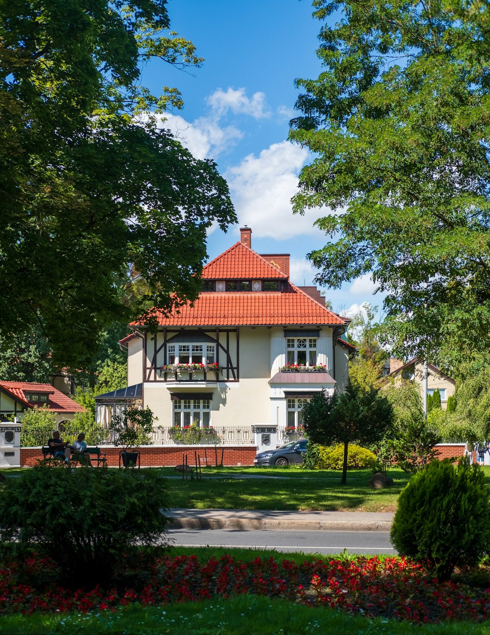 a large white house with a red roof