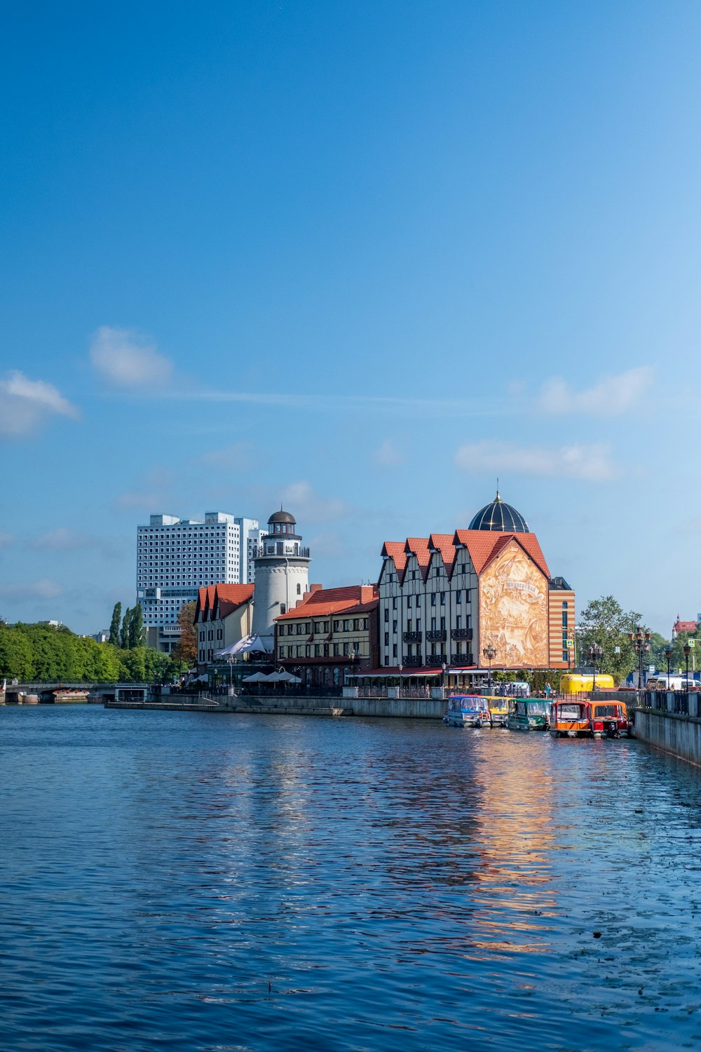 a large body of water with buildings in the background