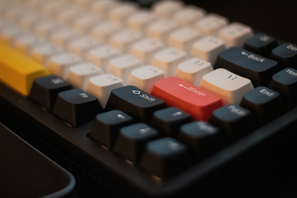 a close up of a computer keyboard with colored keys