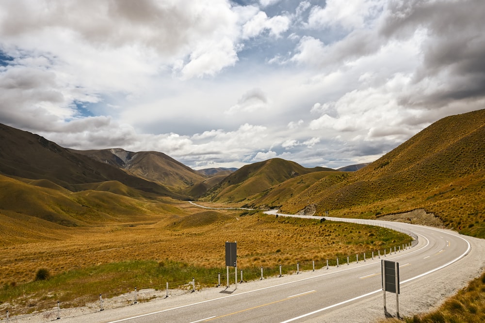 a winding road in the middle of a mountain range