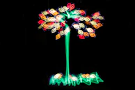 A poster showing a luminous tree of life with roots and branches intertwined in a sacred geometry style.