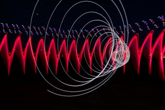 a long exposure photo of red and white lights