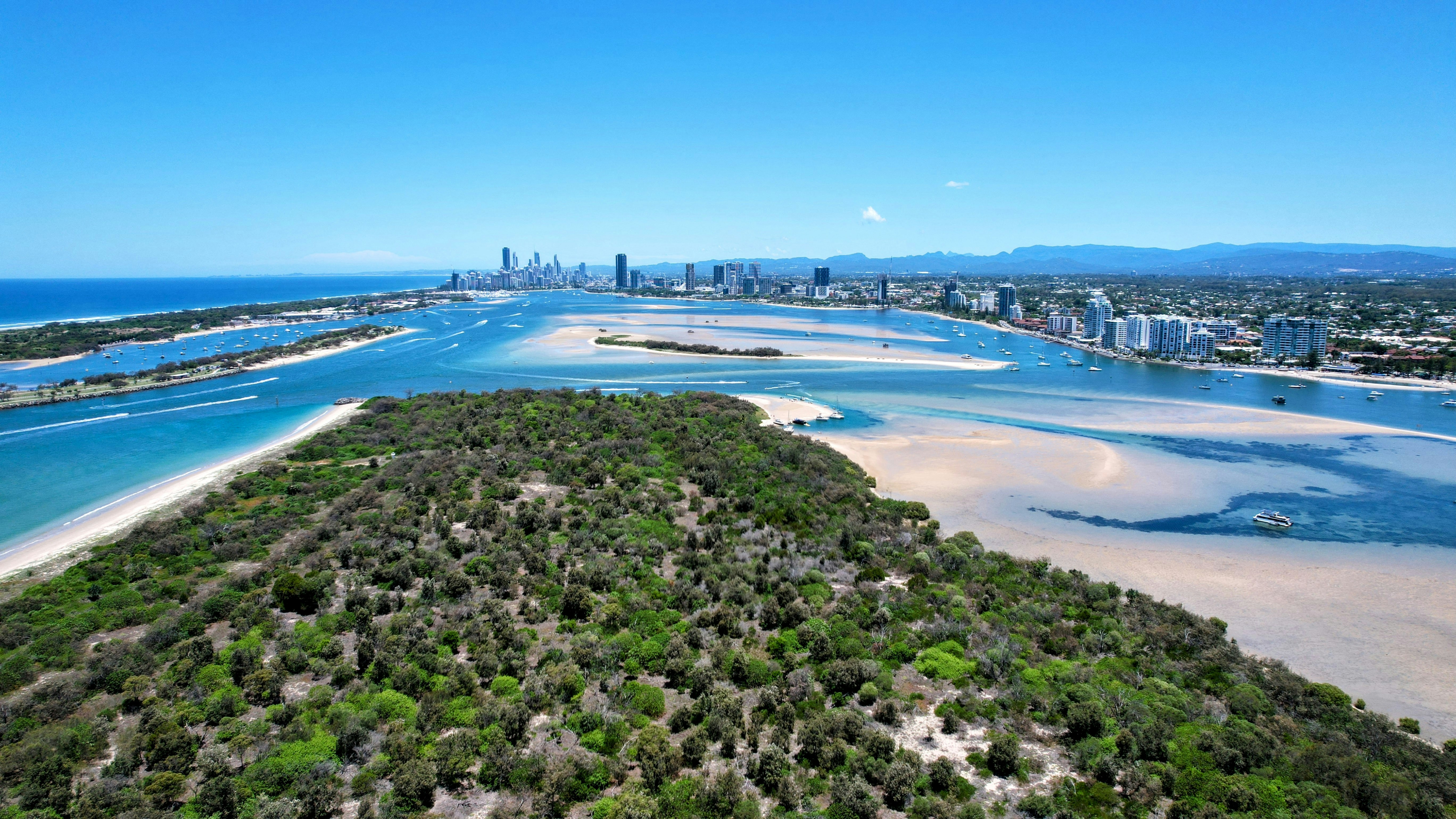 an aerial view of a city and a body of water