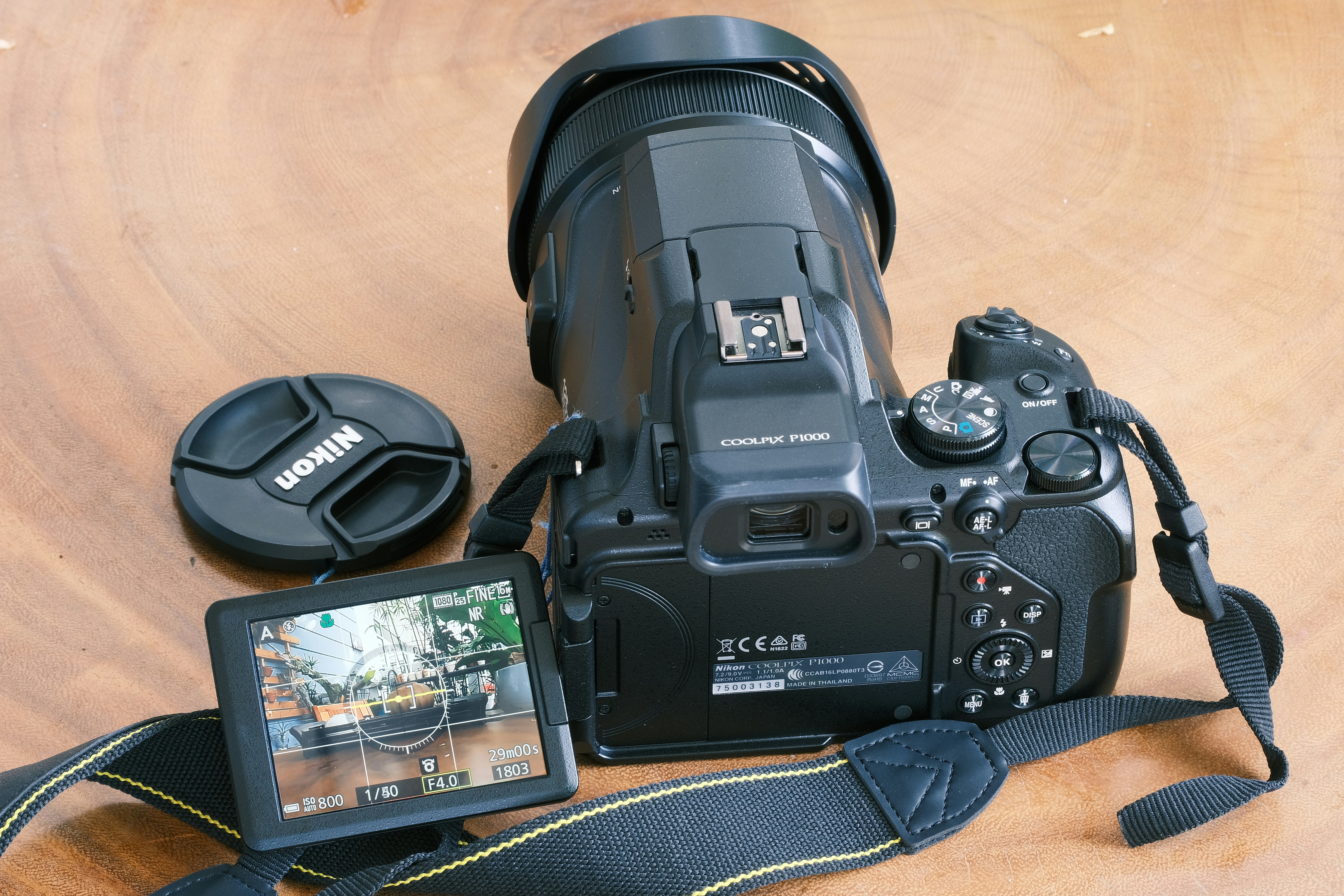 a camera with a lens attached to it sitting on a table