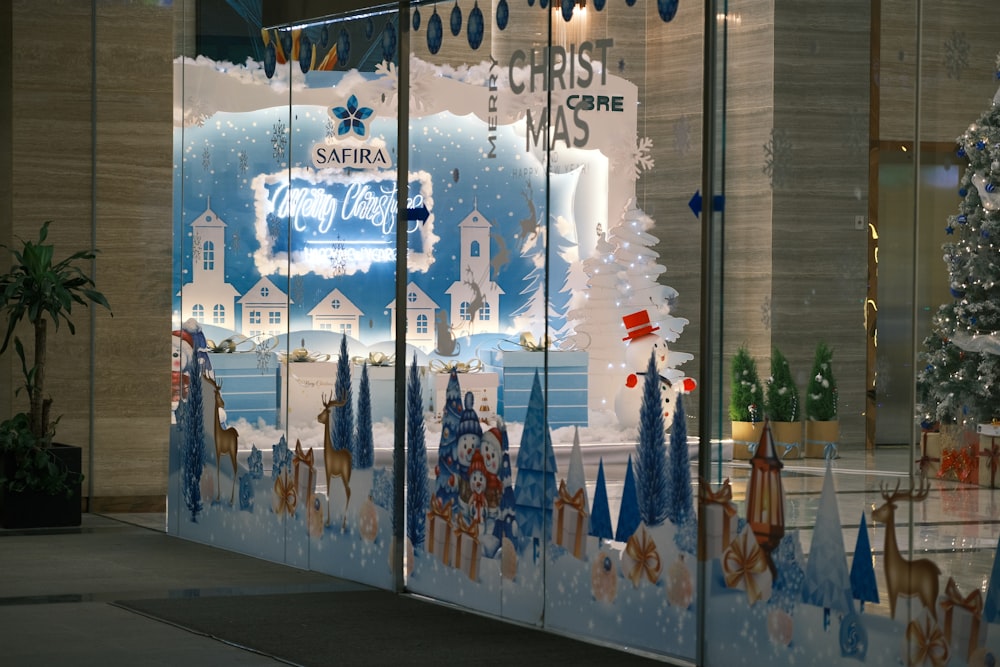 a store window with a christmas scene on it