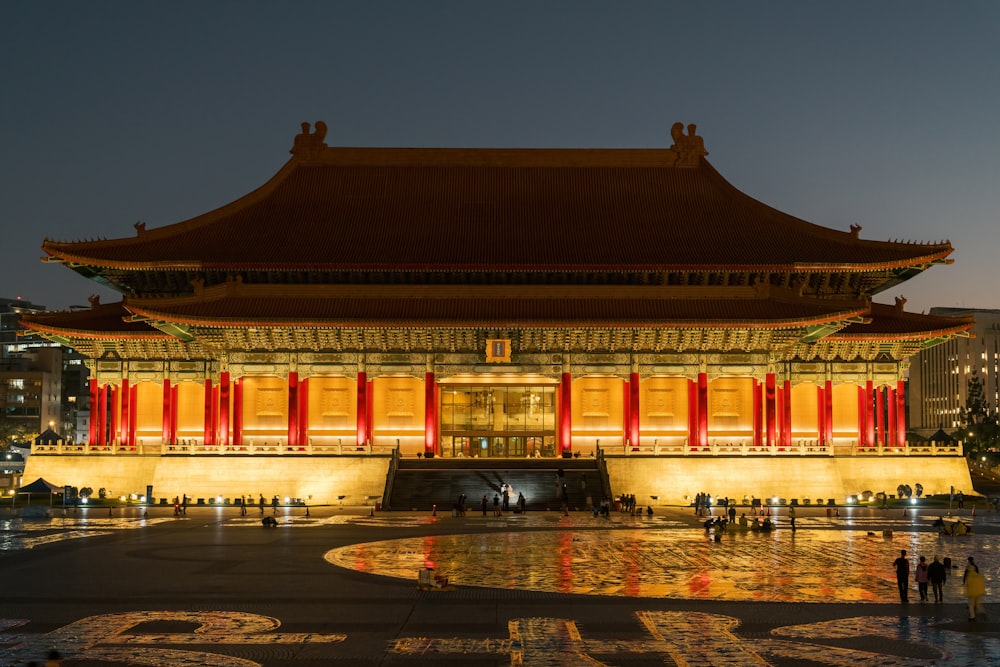 a large building with a lot of lights around it