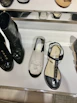Close-up of stylish children's shoes lined up on a wooden shelf