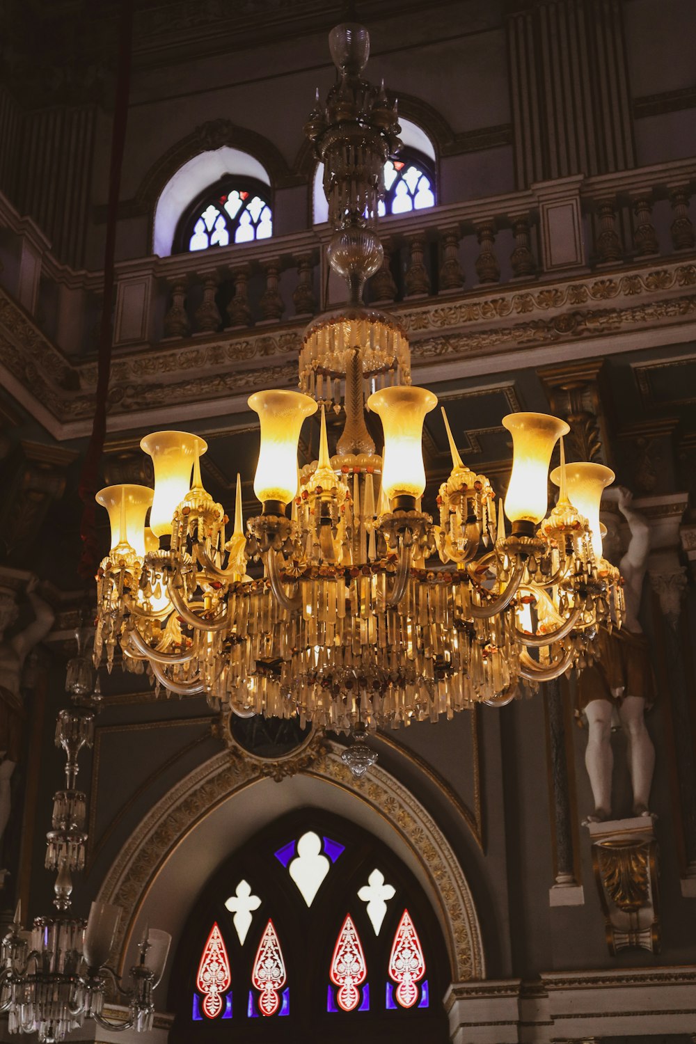 a chandelier hanging from the ceiling of a church
