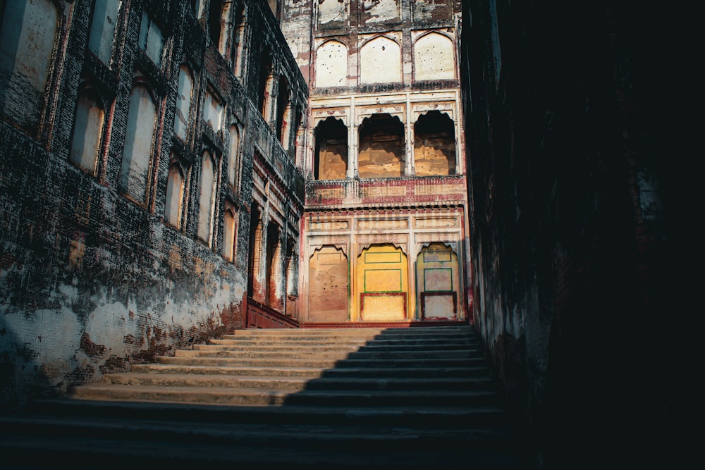 an old building with a staircase leading up to it