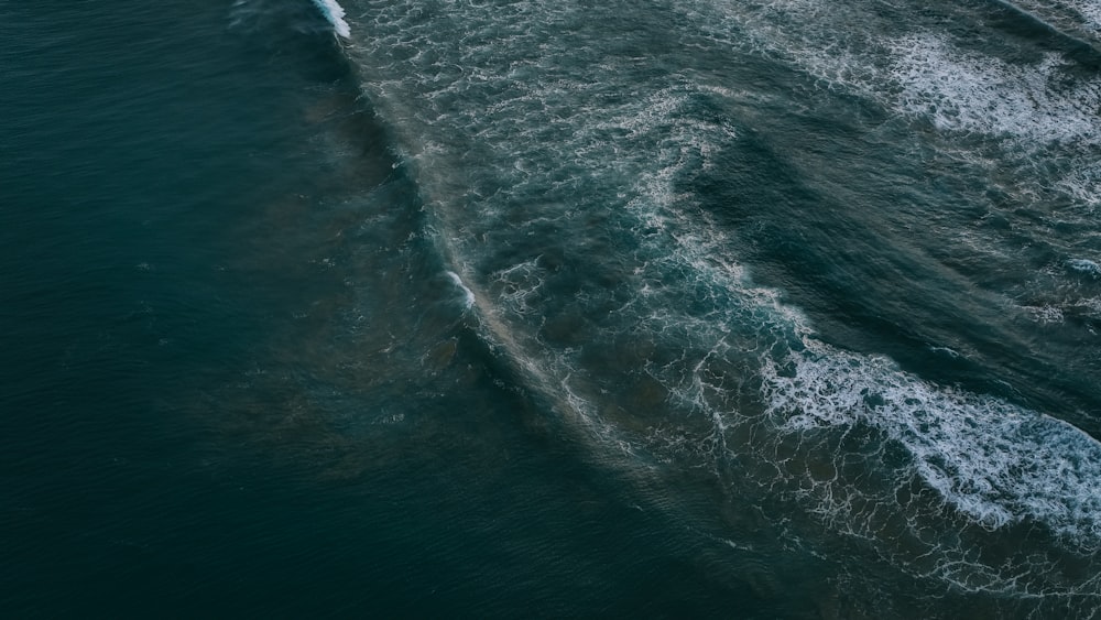 an aerial view of a boat in the water