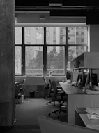 Image showing a clean and organized office space with desks and chairs.