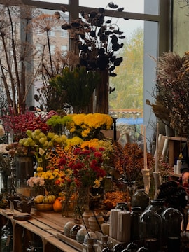 A vibrant home garden showcasing various plants and gardening tools.