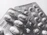 Close-up of a modern industrial blister packaging machine in operation.