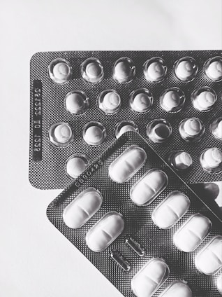 Close-up of a pharmaceutical blister pack prototype with precise child-resistant features.