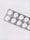 A silver blister pack containing white round pills, placed on a clean, plain background. The packaging is textured and reflective, and each pill is separated in its own compartment.