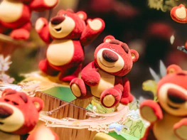 A group of colorful Buddha bears gathered together in a circle, radiating warmth.