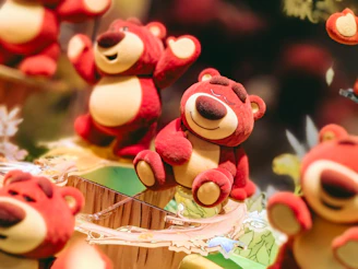 Colorful illustration of Boo Bear and friends happily singing and playing together.