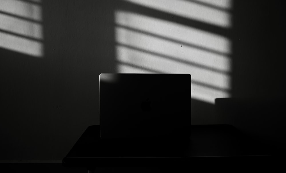 a laptop computer sitting on top of a desk