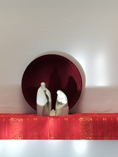 A set of three minimalist 3D baby hand and foot casts displayed on a black and white background.