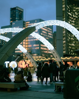 A group of holiday lighting enthusiasts gathered around a projector during a lively Light Up Arizona meetup.