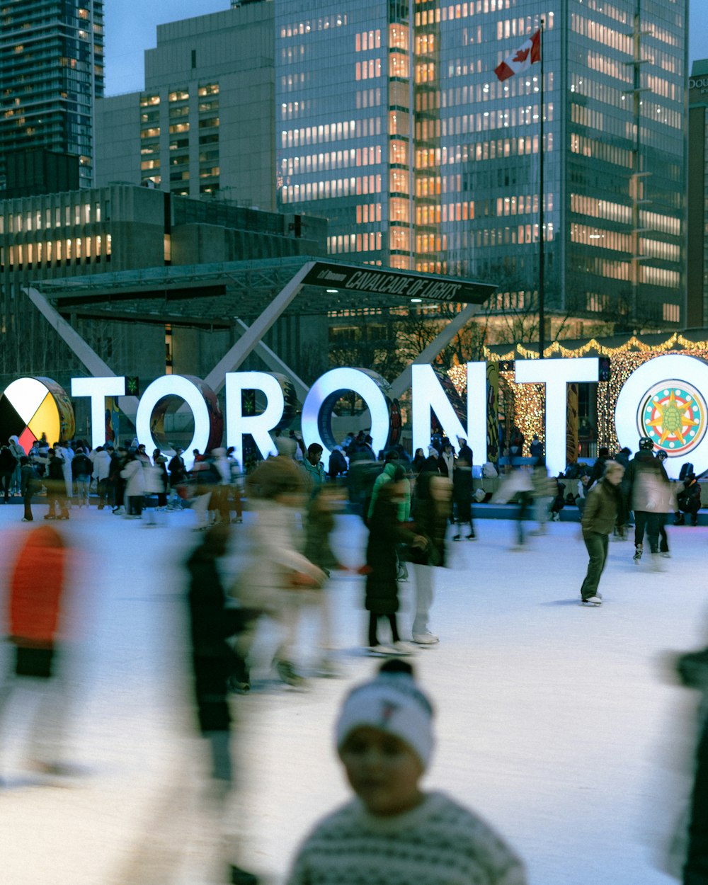 a group of people skating on an ice rink