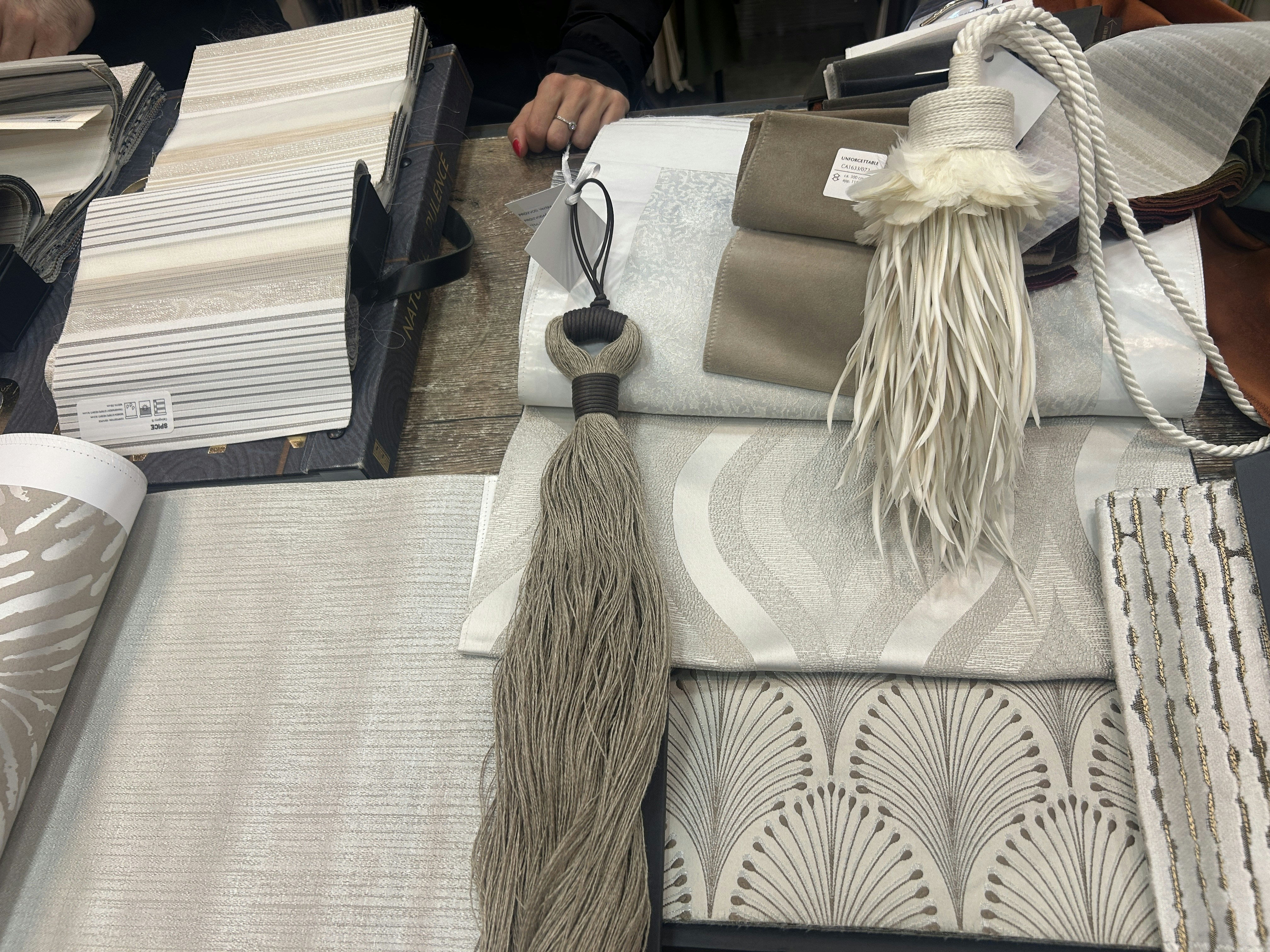 Assorted specialty fabric samples arranged artfully on a neutral surface