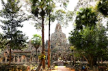 Ancient temple surrounded by lush green jungle foliage
