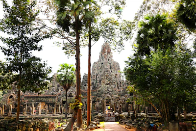 Ancient temple surrounded by lush green jungle foliage
