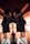 A person wearing a black cropped top and white Calvin Klein underwear is positioned back-to-back against a mirror, creating a symmetrical reflection. The lighting casts warm, orange-toned shadows and lines across the scene, creating a dramatic visual effect.