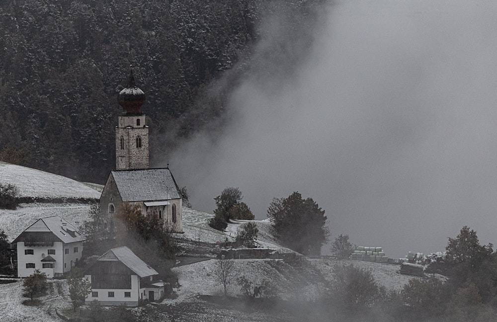 a church in the middle of a snowy landscape