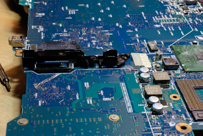 Close-up of a sleek TV circuit board with colorful components and connectors.