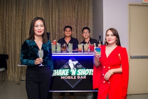 A group of bartenders sharing tips and laughs during a workshop event