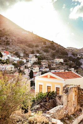 Golden sunlight illuminating the terracotta rooftops of a charming medieval village.