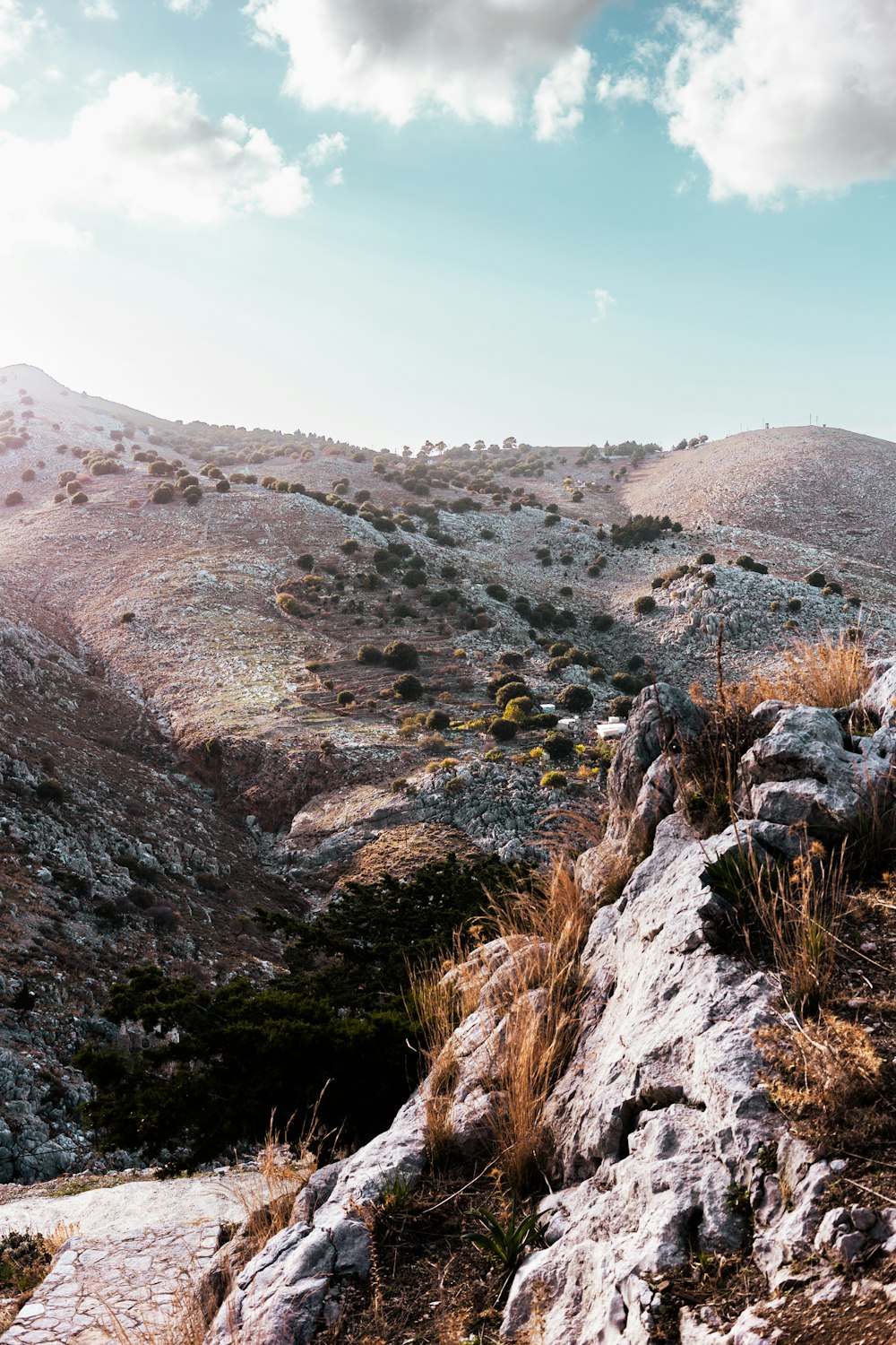 a view of a rocky mountain with a sky background