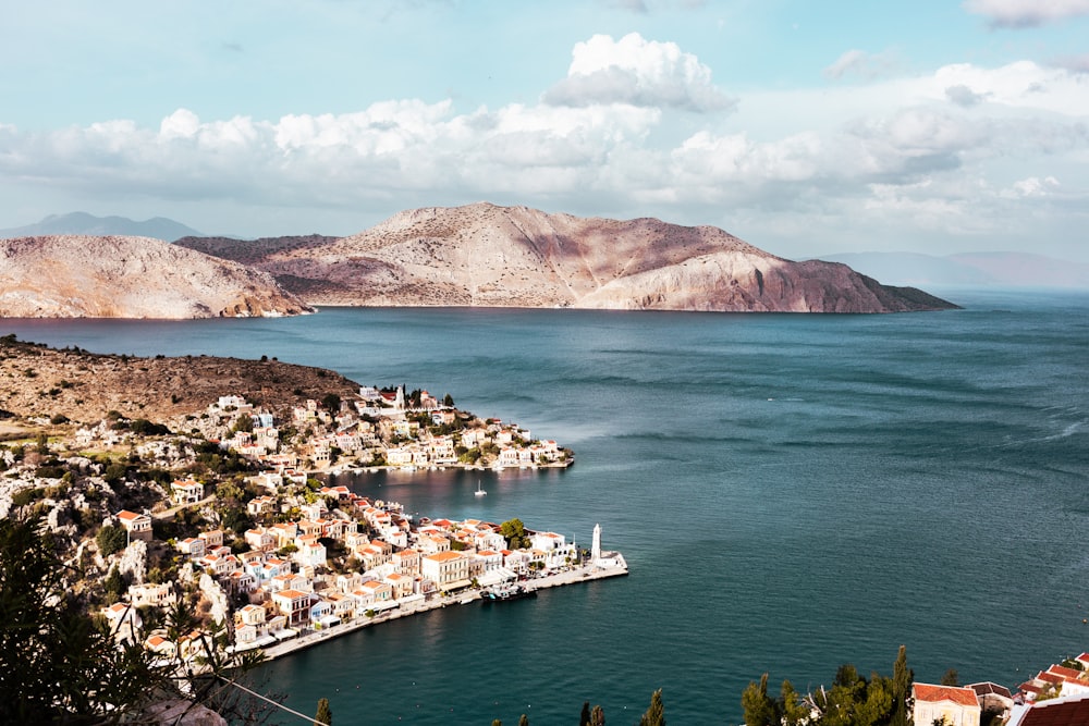 a view of a small town on the water