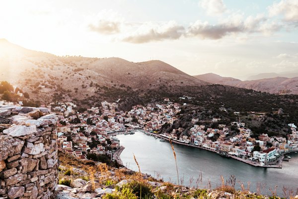 A view of a city and a body of water — Symi, Greece