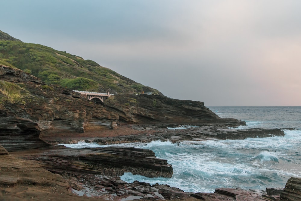 a view of the ocean from a rocky cliff