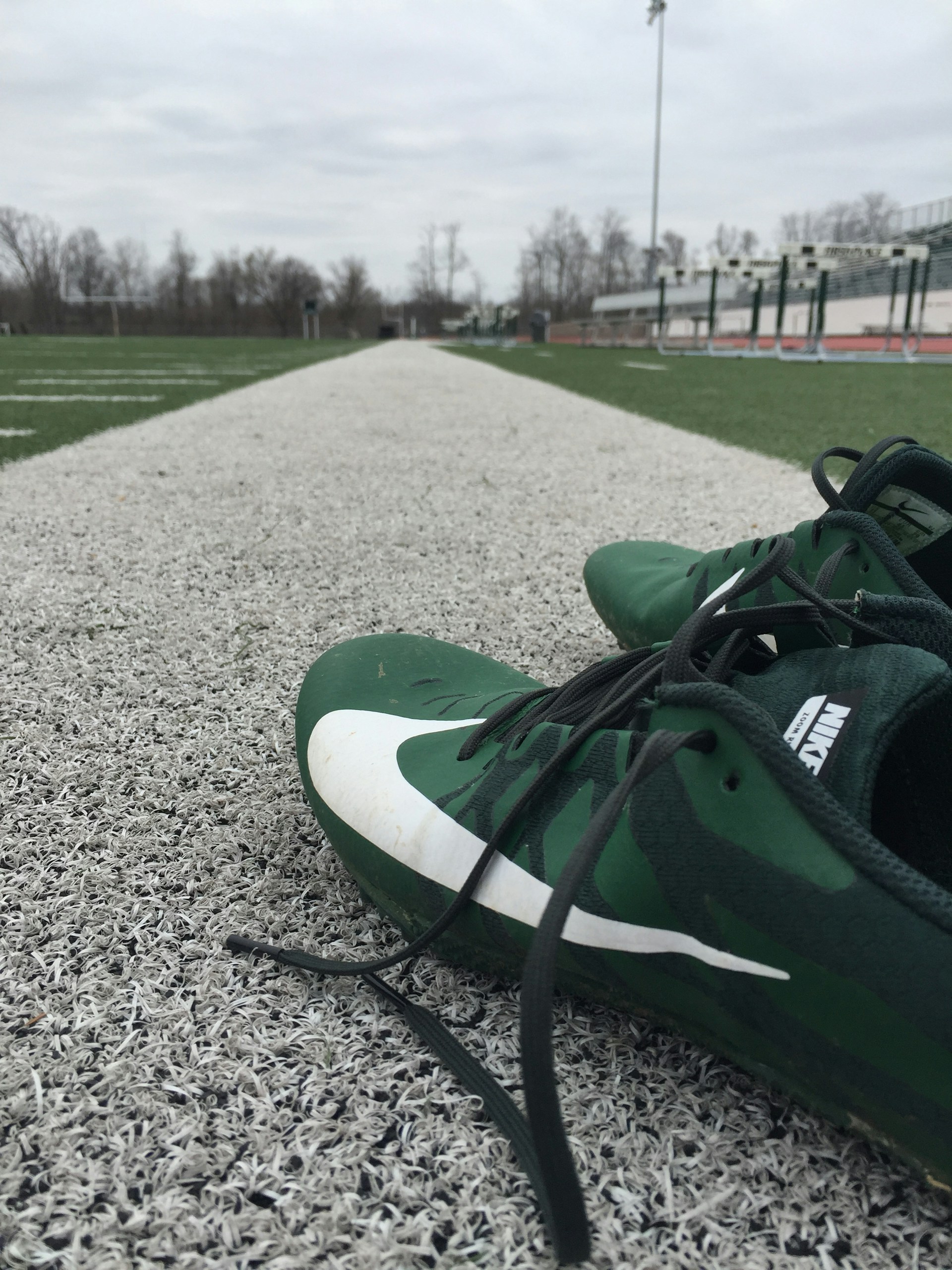 person wearing grey knit sweater